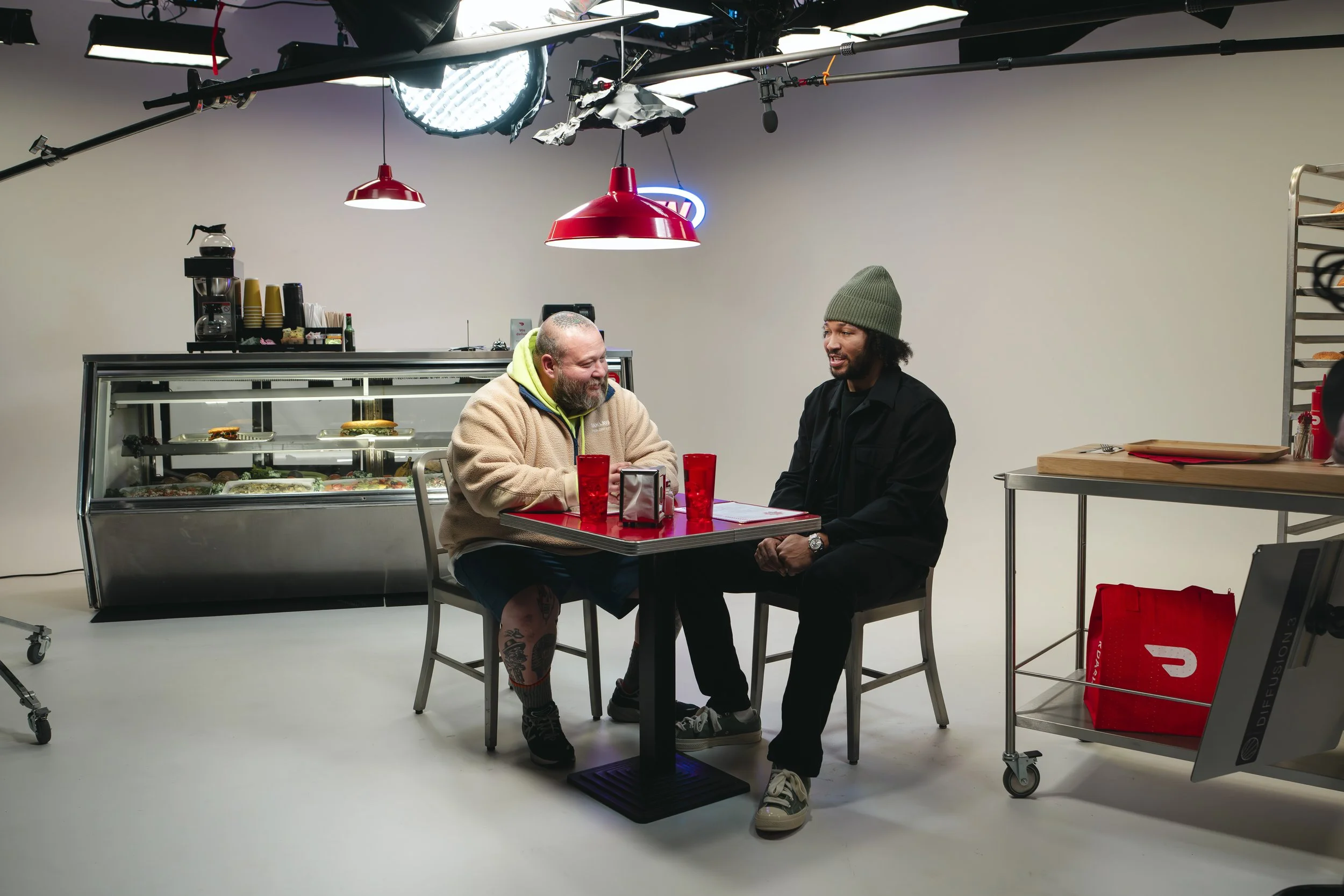 Jalen Brunson and Action Bronson tasting sandwiches for DoorDash's The Brunson content series