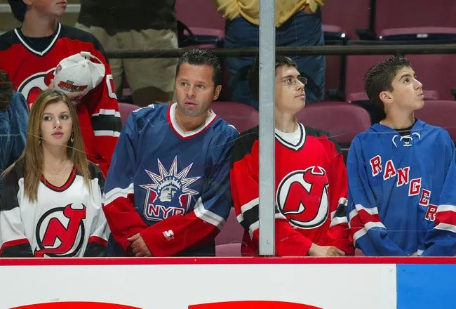 New York Rangers fans holding Delta boarding passes before a charter flight